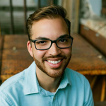 headshot of Ryan Laboy, white man with short, brown hair and beard smiles