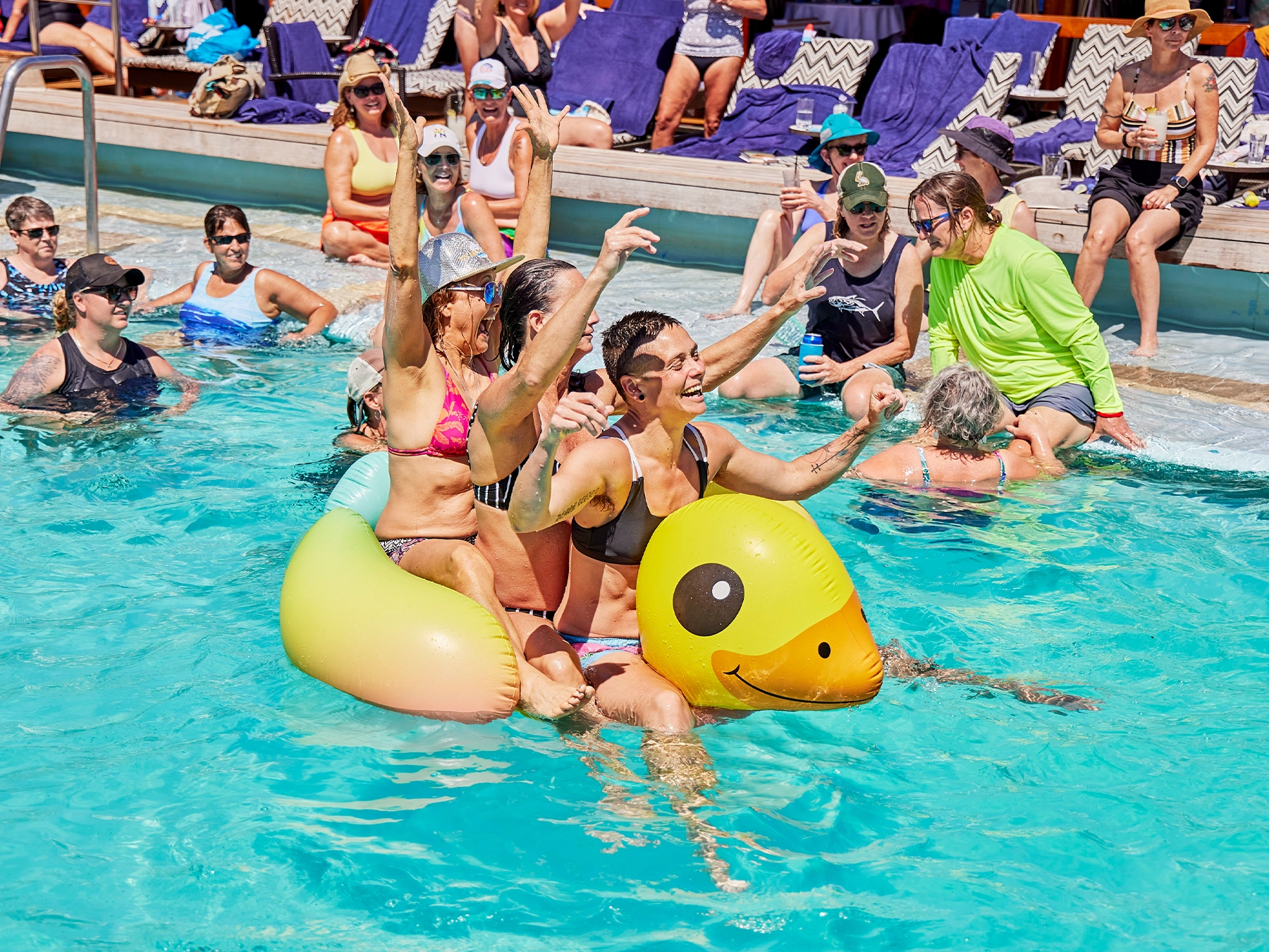 women enjoy themselves at the pool on an Olivia cruise