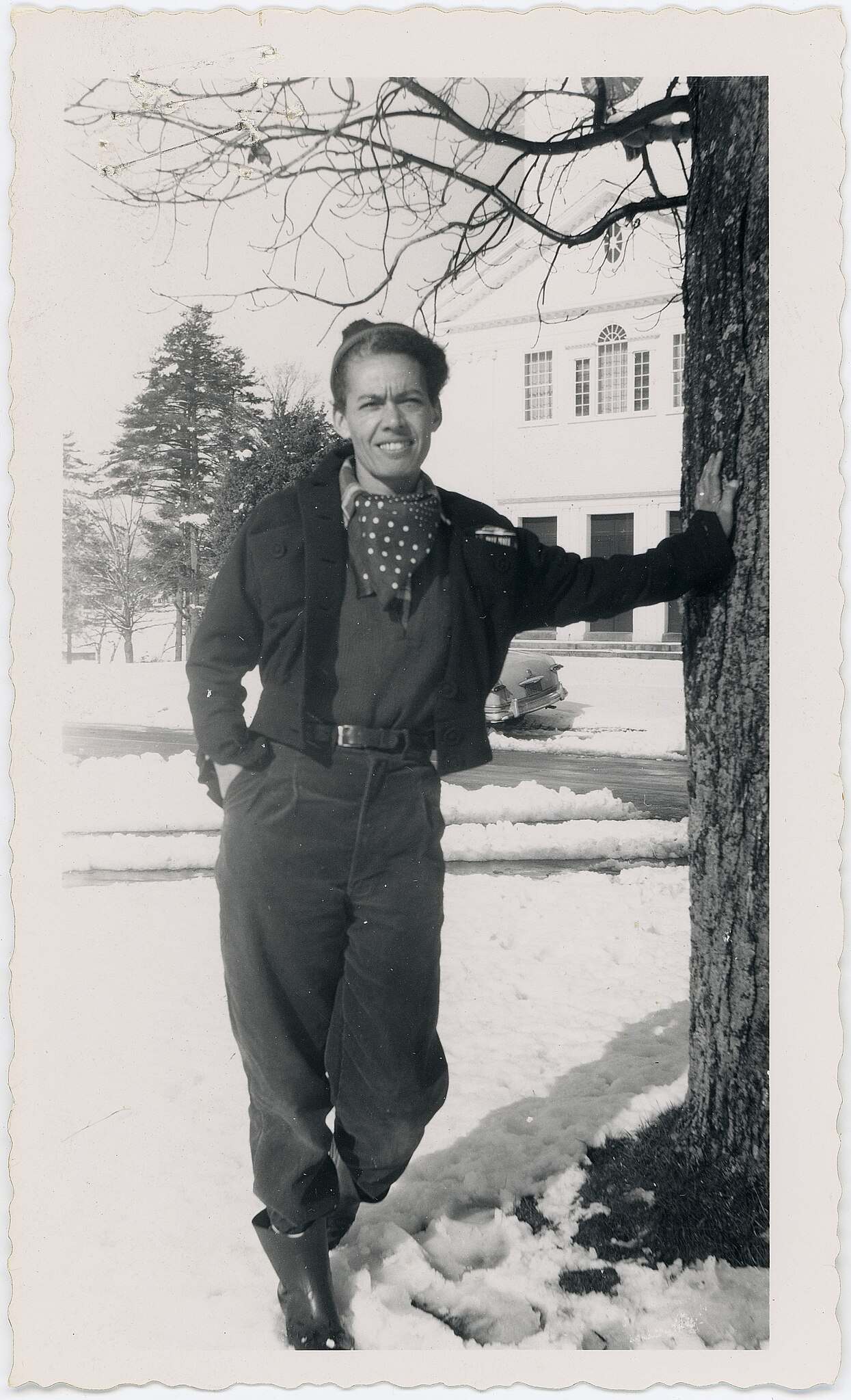 30 year old African American Pauli Murray in black pants, cropped jacked and a scarf.