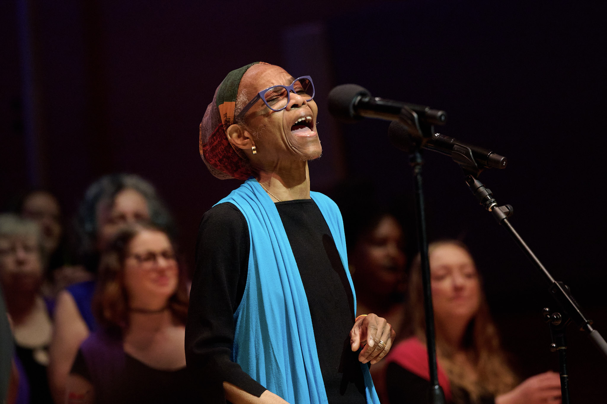 A singer from Anna Crusis Feminist Chorus performs in Orchestra Hall at Festival 2024.