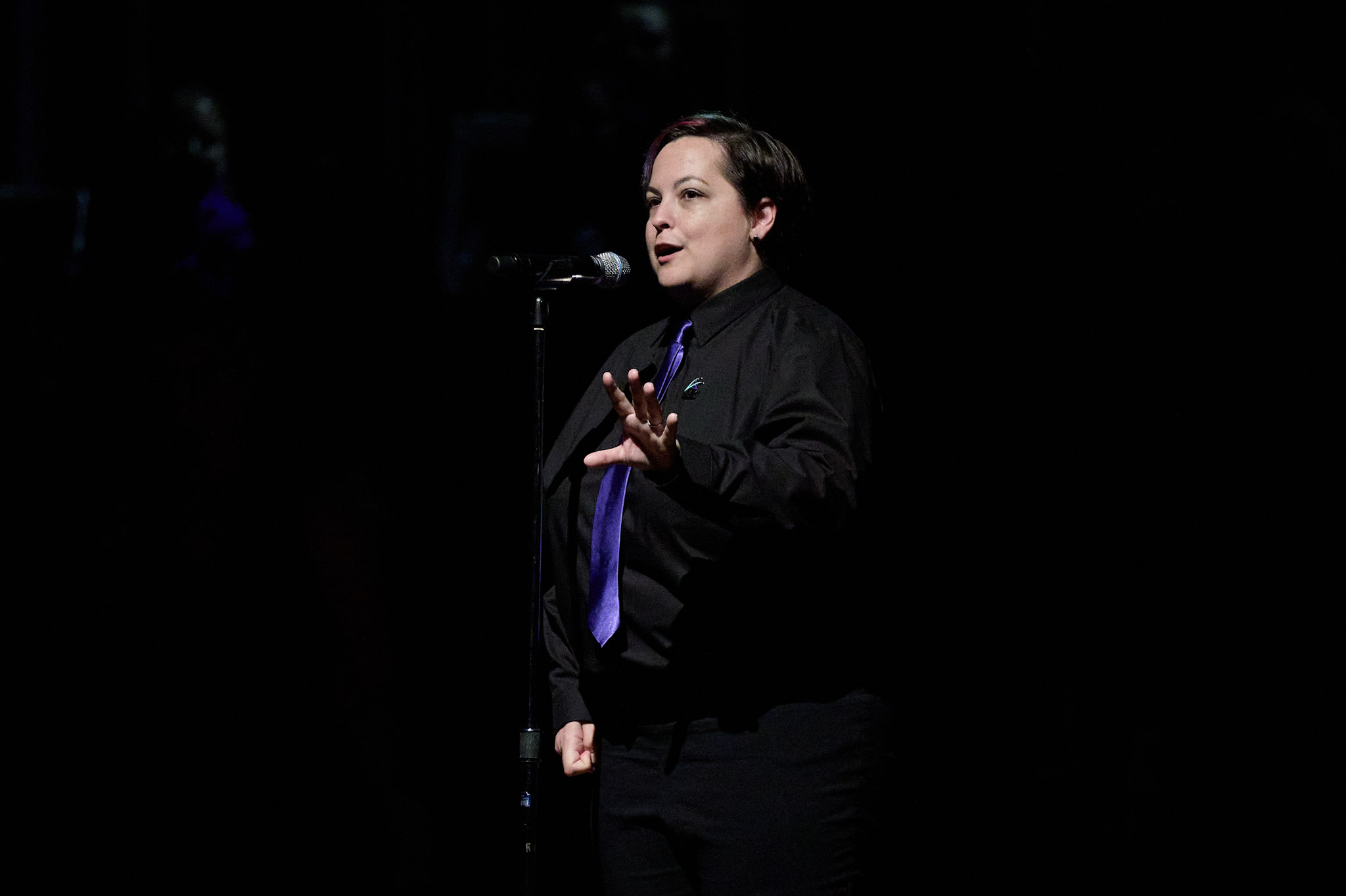 A soloist in black with a purple tie performs at Festival 2024.