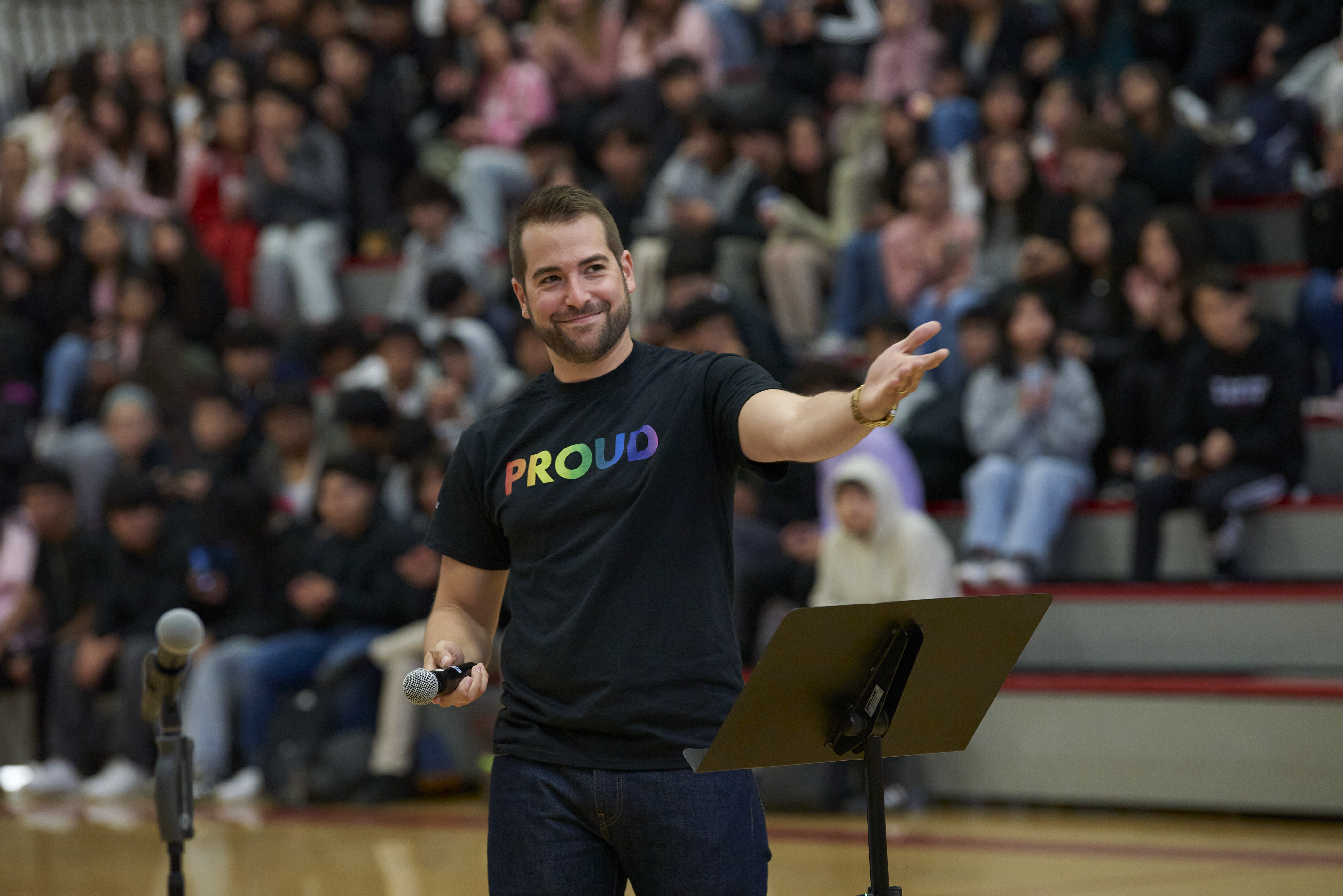 Mitch Galli, a white man with brown hair and a beard, wears a black shirt with the word 